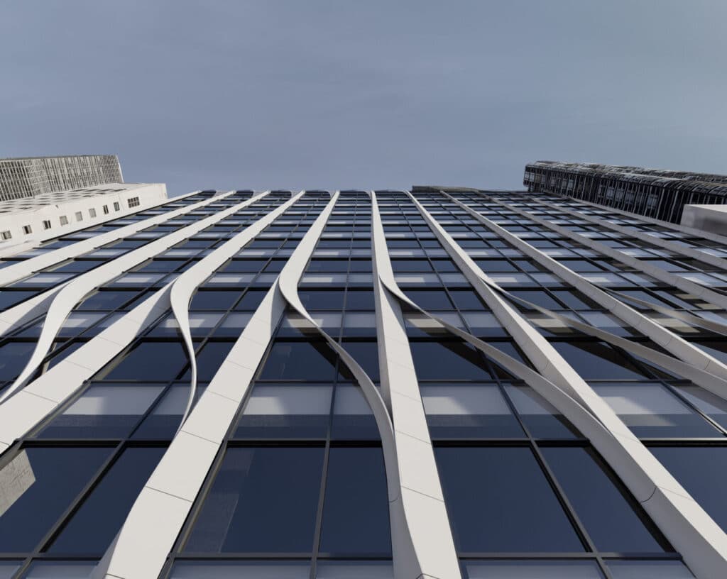 Upward view of UN Plaza's flowing vertical facade with curved white terracotta fins creating wave-like patterns between glass panels against Manhattan skyline